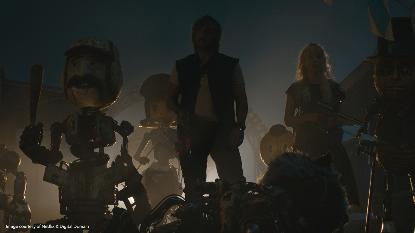 Chris Pratt as John D. Keats and Millie Bobby Brown as Michelle Greene with team of robots in The Electric State