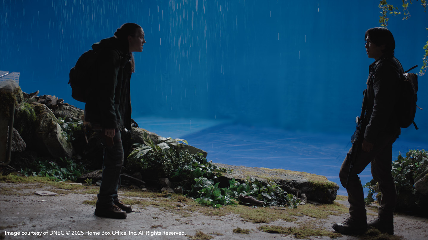 Ellie and Jesse in front of blue screen in The Last of Us season 2