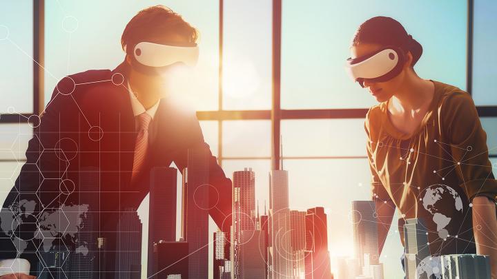Two people wearing VR headsets